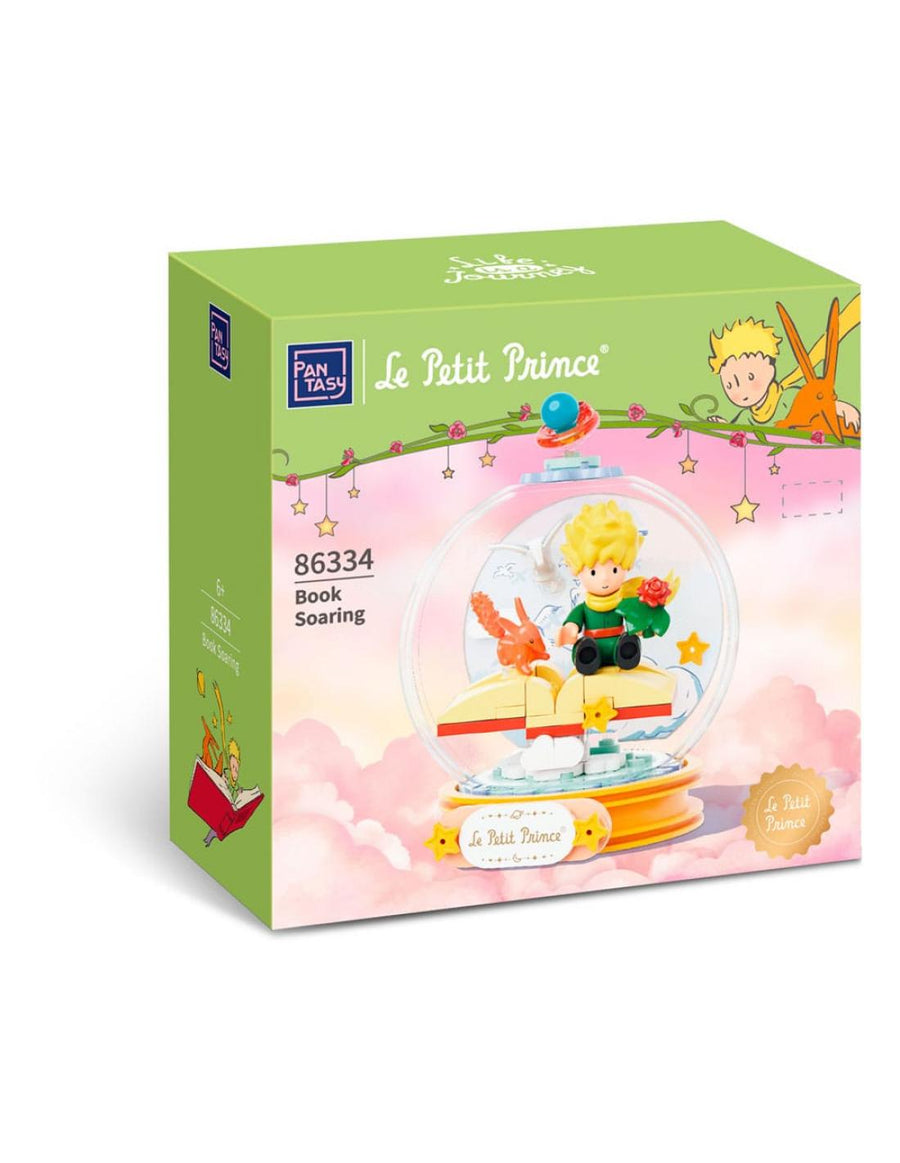 Maqueta de construcción : El Principito sentado en un libro