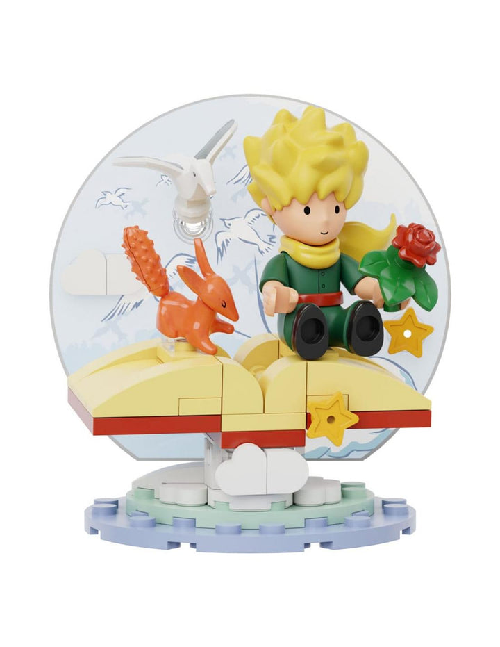 Maqueta de construcción : El Principito sentado en un libro